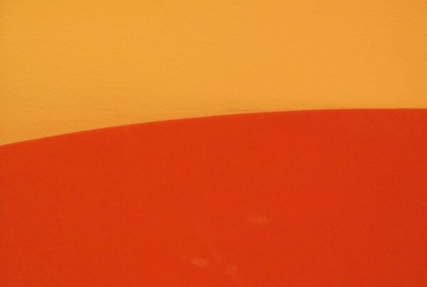 a close up of a surfboard on a wall